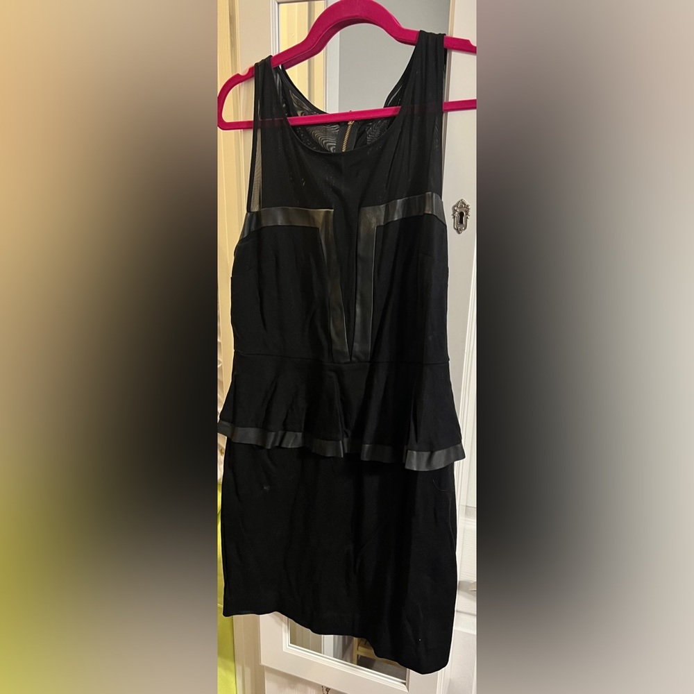 Black express peplum dress. Mesh and leather.